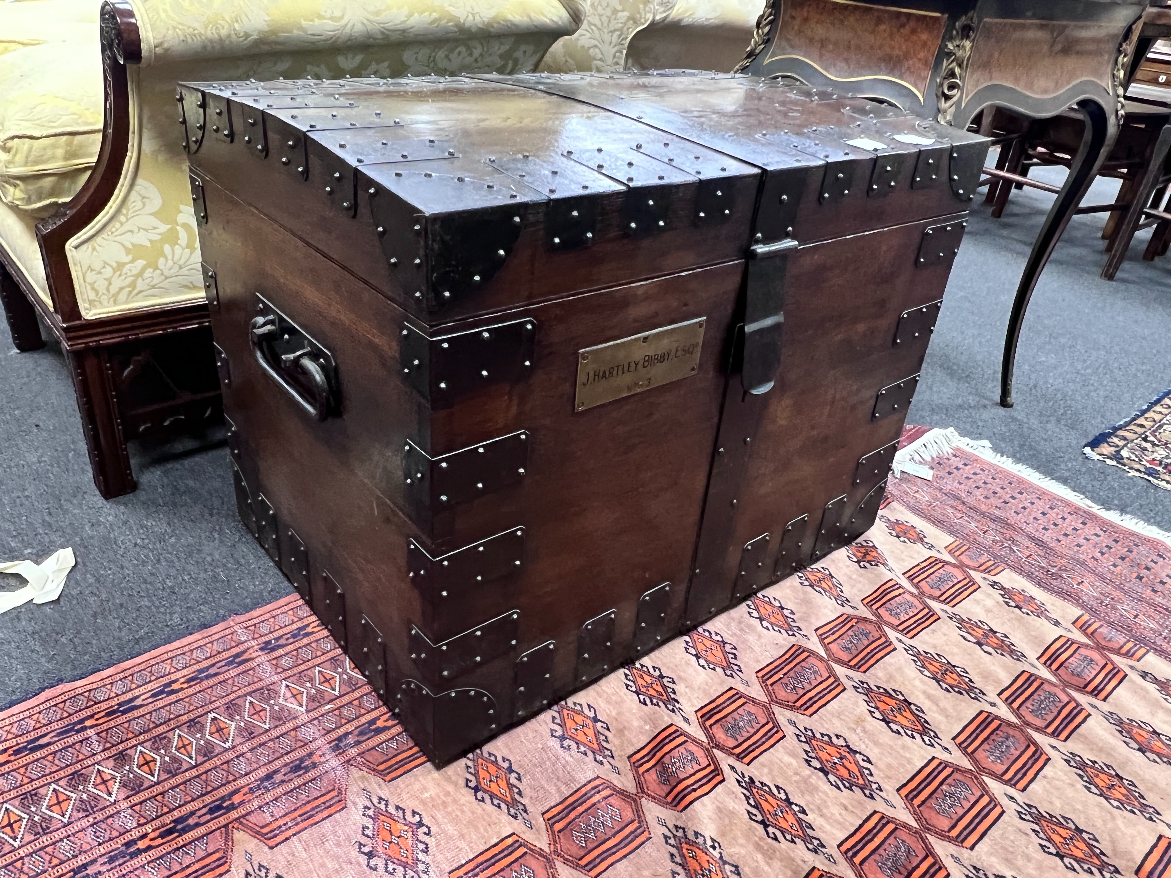 A Victorian iron bound oak silver chest, the engraved brass plaque marked J. Hartley Bibby Esq No. 3, bears interior Goldsmiths & Silversmiths ivory plaques, width 81cm, depth 56cm, height 63cm